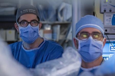 Dr. Sean Bennett and Dr. Sunil Patel performing robotic surgery at KHSC