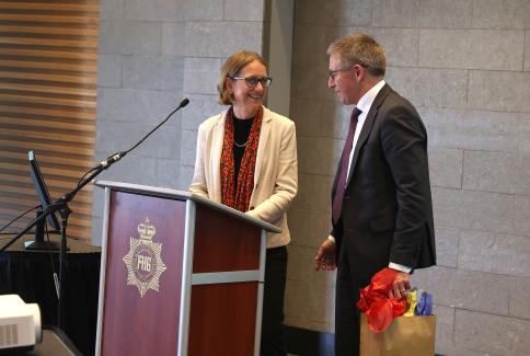 Professor Alison Noble at podium with Dr. Ross Walker